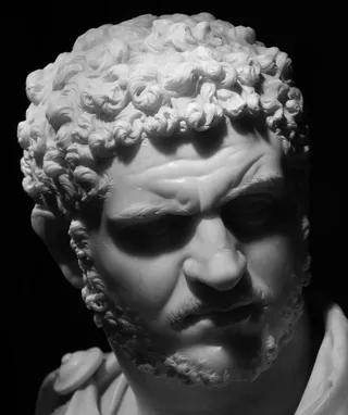 A Roman marble bust in greyscale